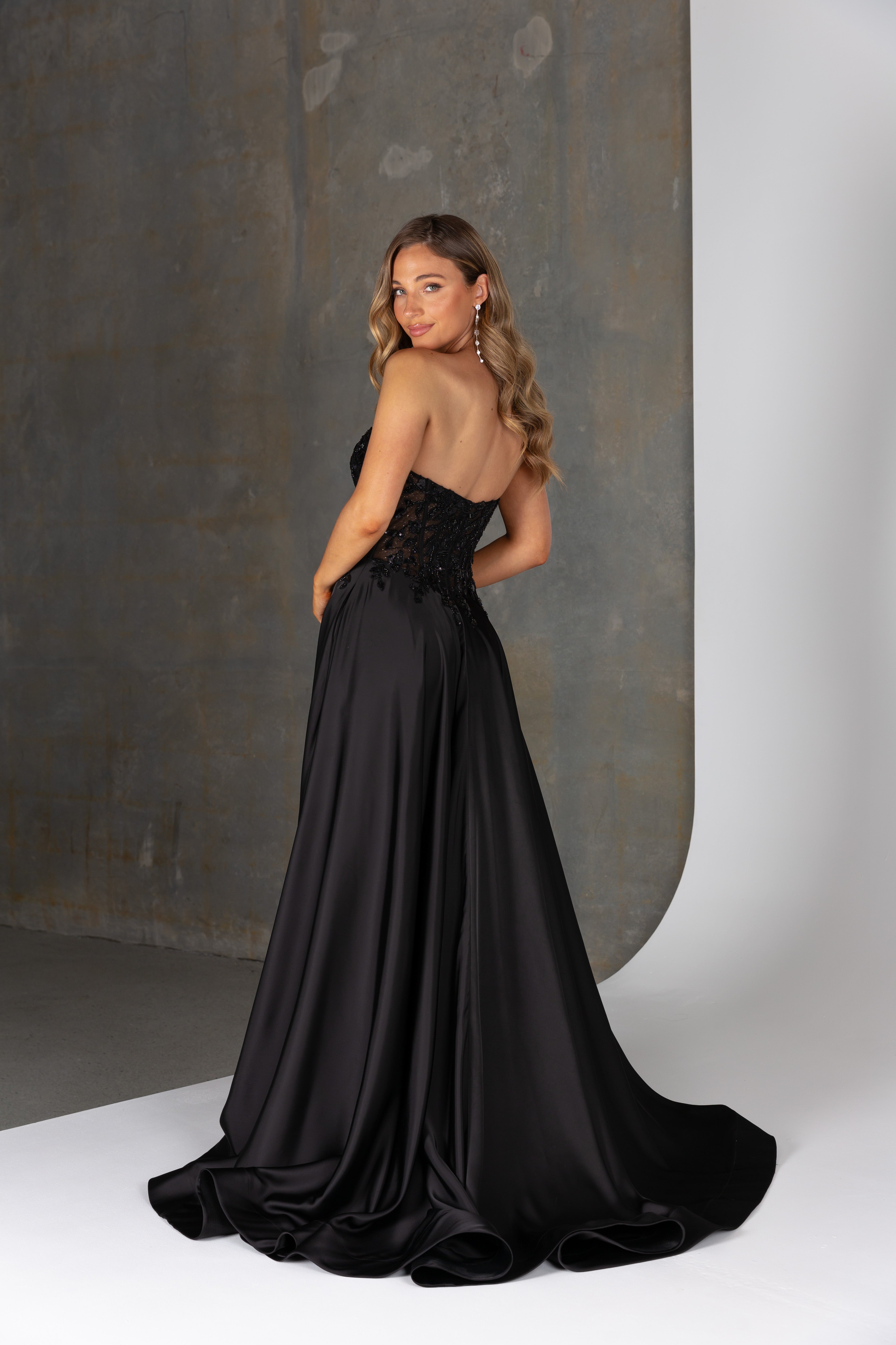 Back view of Alpha dress – illusion lace corset back with invisible zip and full satin skirt with structured hem.