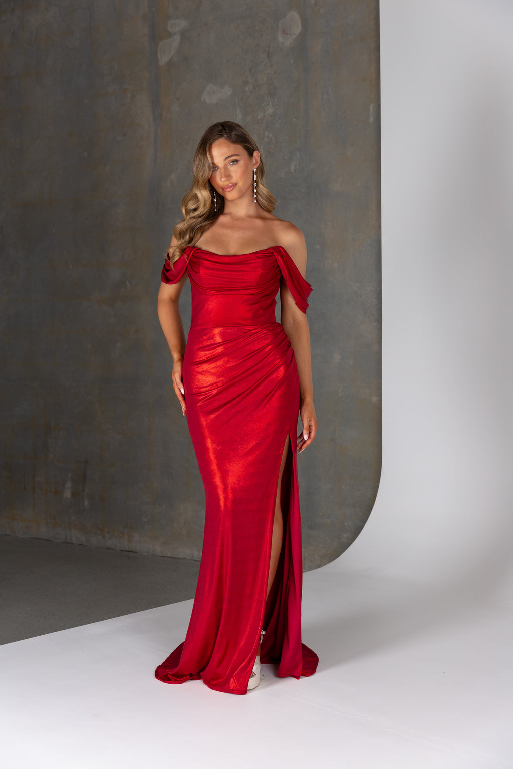 Beryl formal dress by Tania Olsen – off-the-shoulder deluxe jersey gown with scoop neckline and high leg split.