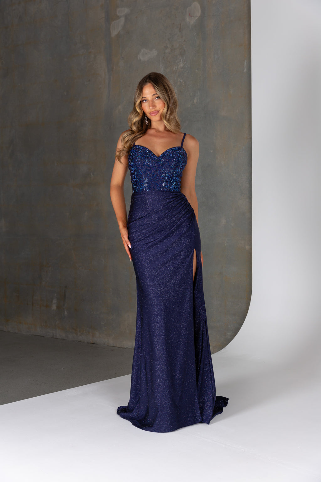 Echo PO25165 formal dress – sparkle jersey gown with heat set crystals, spaghetti straps, ruching, and high leg split.