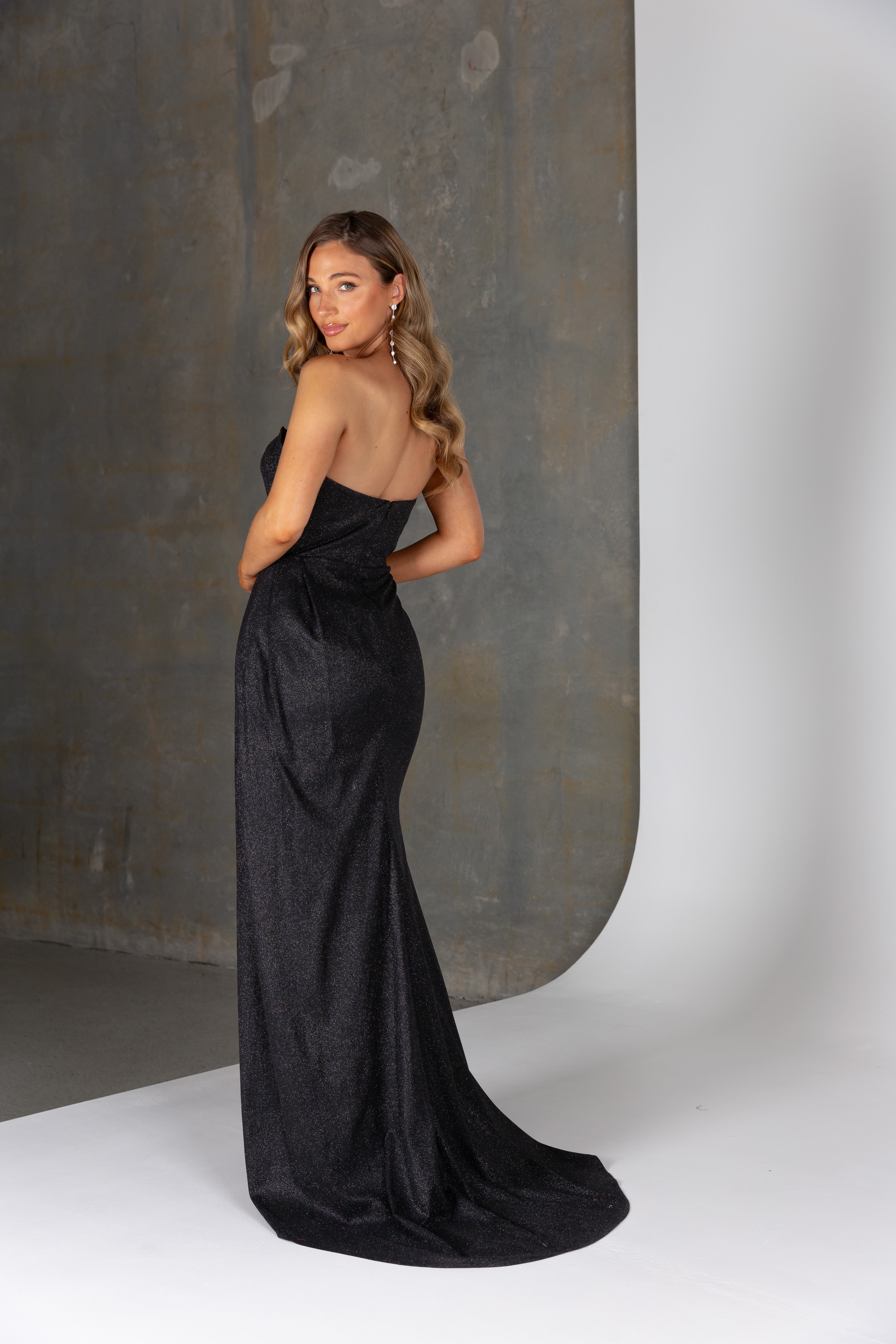 Back view of Livia formal dress – strapless sparkle satin gown with invisible zipper and sculpted silhouette.
