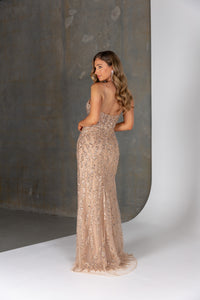 Back of Nyx formal dress – illusion beaded corset back with spaghetti straps and nude-lined fitted skirt.