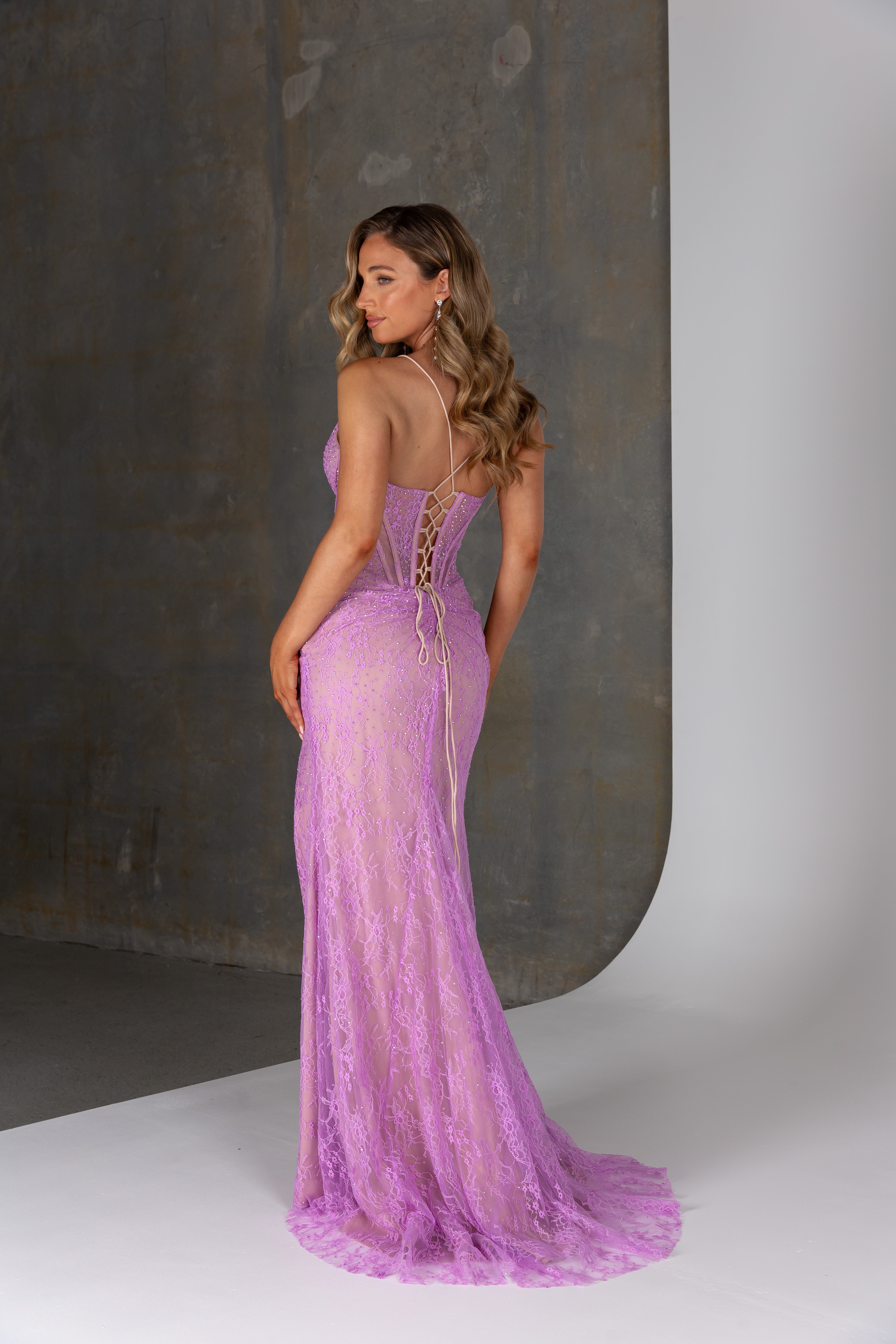 Back of Zadie dress – lace-up corset back with nude lining and floor-length lace skirt.